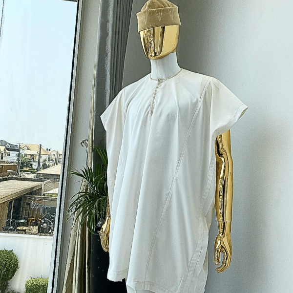 A Hand picked (jakan design) ivory white dashiki buba, sokoto & a cream patterned wool hat.