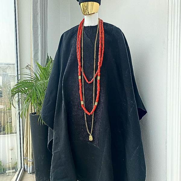 A charcoal black aso oke agbada with box patter embroidery design