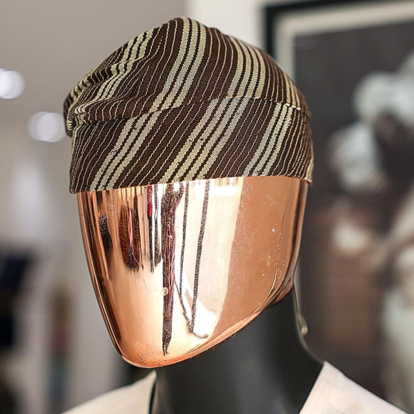 An umber brown Yoruba traditional African hat or fila